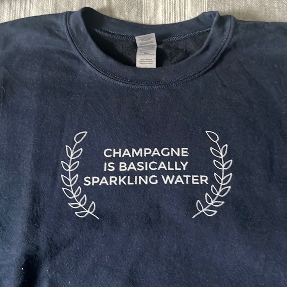 Navy blue sweatshirt champagne is basically sparkling water